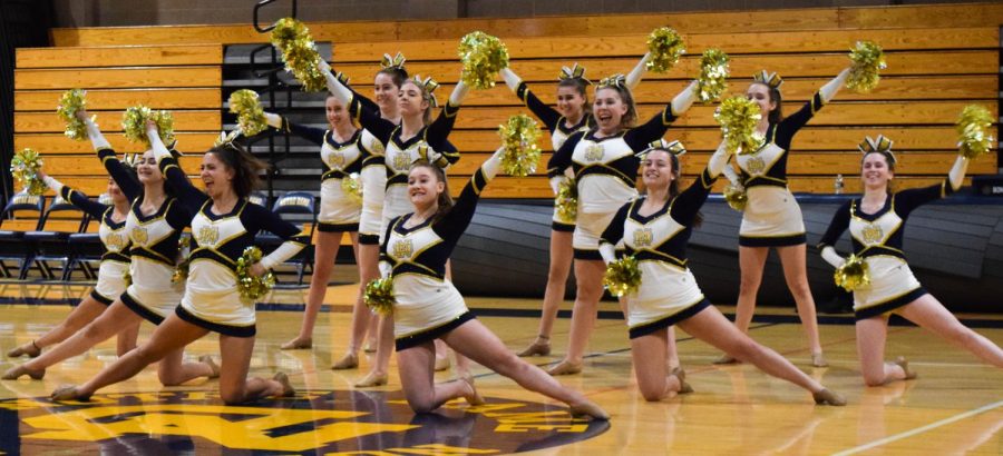 The pom team performs for the student body at the raffle assembly.