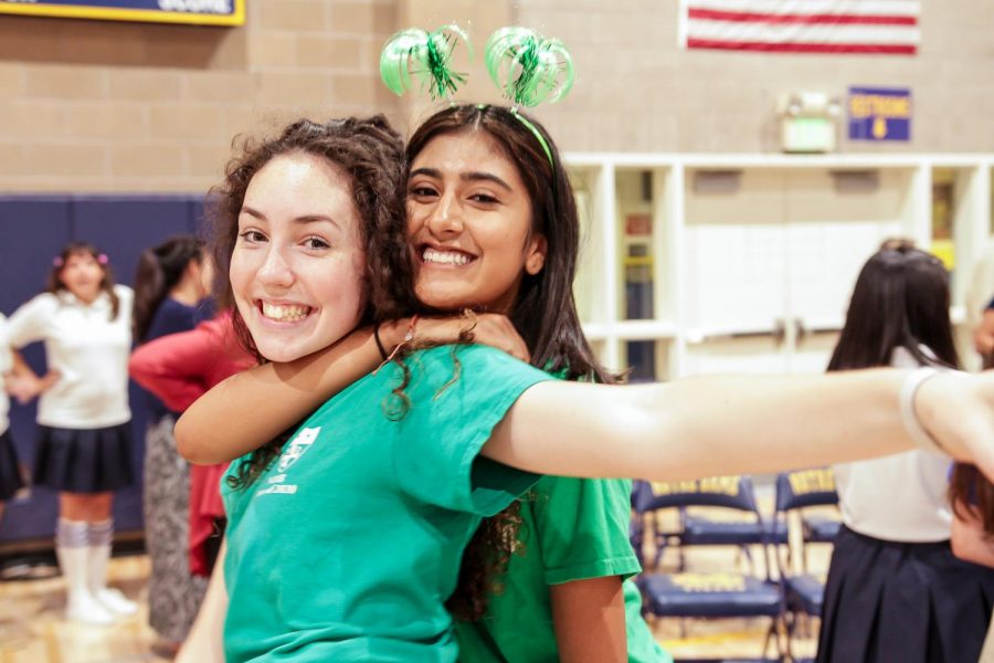 Juniors Kate Rose Keighran and Bianca Lopez hug after the Welcome Back Rally.