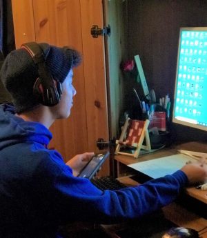 Local student Jason Huang spends time on his computer doing his homework just a couple of hours after he already spent time on his computer for school.