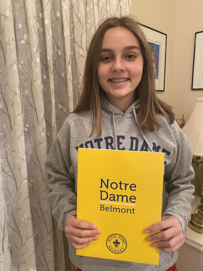 Sara Muzzi posing with her NDB application forms.