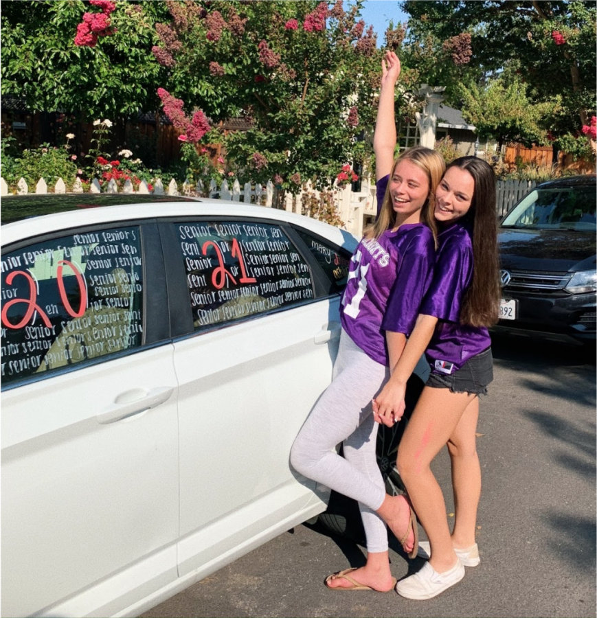 Seniors, Charlotte King and Juila Granucci celebrate their class by decorating their car for senior year.