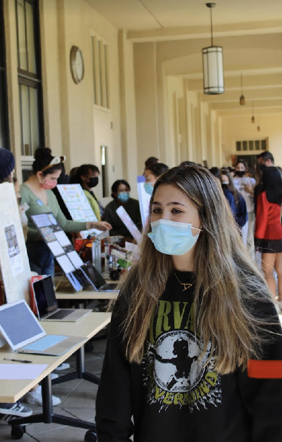 Sophomore Ava Hiss browses through the many club tables at the annual Club Fair held in the Father Downey Garden on Friday, September 3.