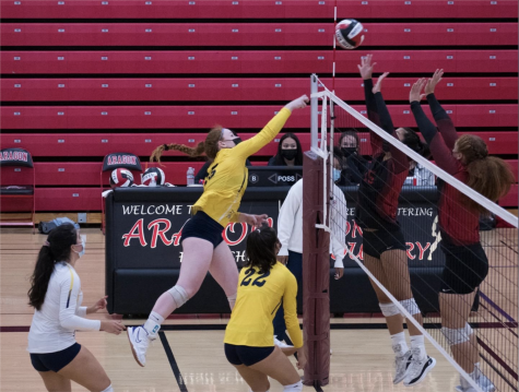 Ciara Mangan (#15) clears the net during a game against Aragon HS.