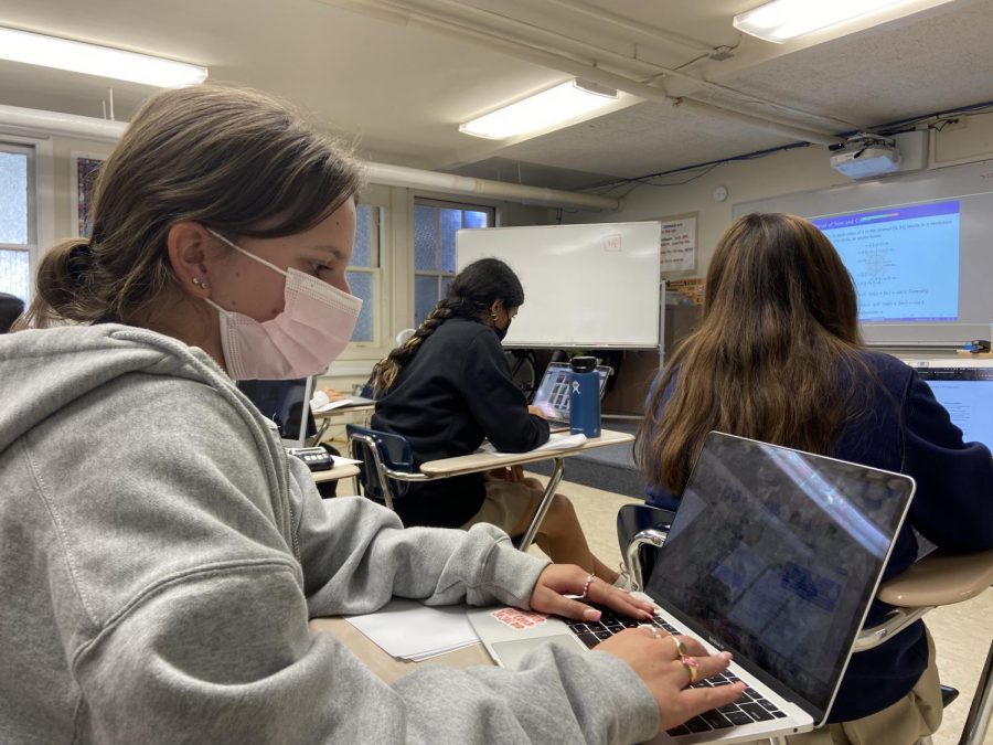 Juniors in math teacher Leonardo Bardomero’s classroom view lessons on their laptops, instead hard copy textbooks or handouts.