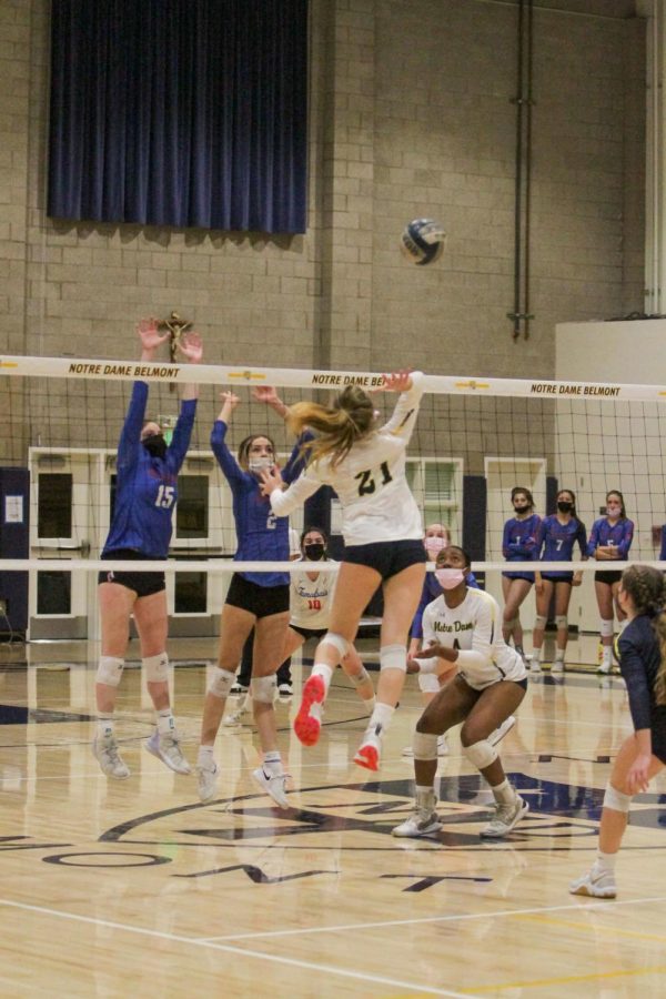 Karly Bordin receives a set from Alexis Curry and jumps to spike it to Tamalpias