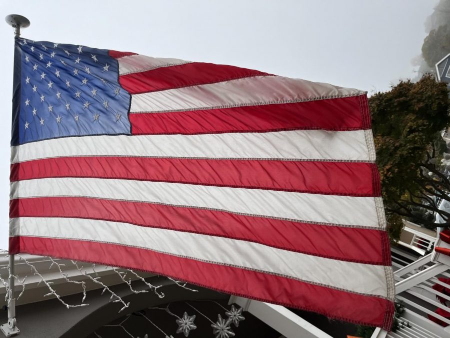 An American flag hangs off the home of a patriotic neighbor.