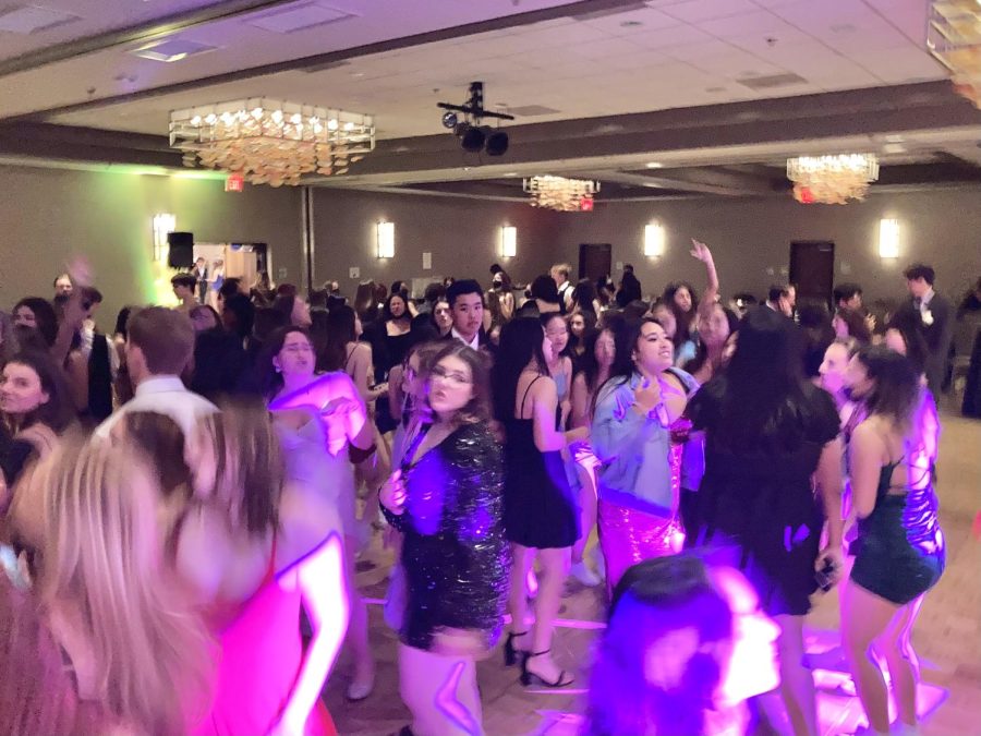 Students step out onto the dance floor with their dates and friends.