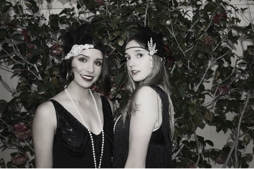 Georgia+Blaney+and+Ava+Marinos+show+off+their+flapper+costumes+and+headpieces+at+the+2022+Gatsby+Ball.