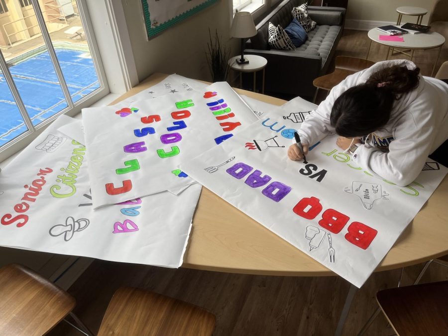 ASB Spirit Director Zeina Zumot works on signs representing each of the Spirit Days to hang in the hallways.
