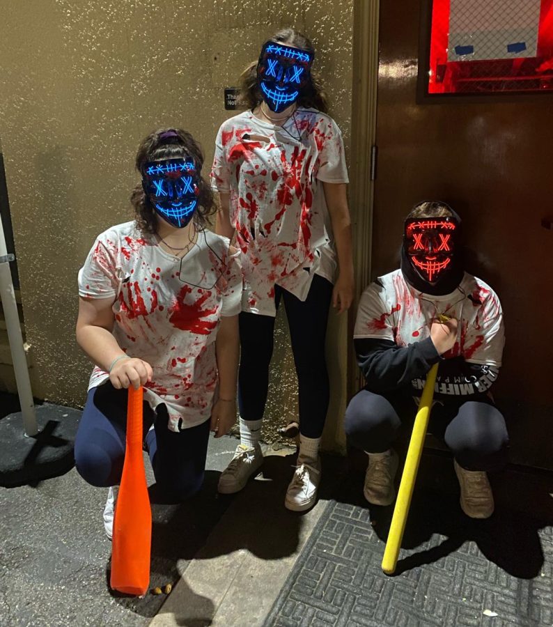 Link Crew members used masks and baseball bats as props to scare freshmen.