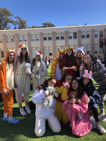 Freshmen show excitement for wearing onesies all day. 