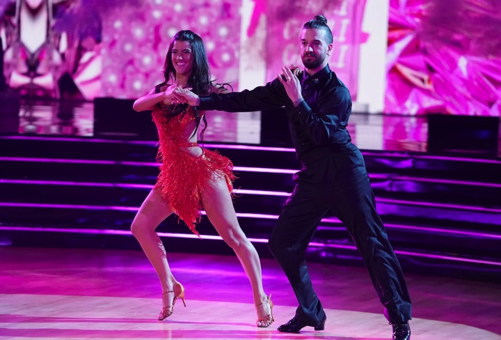 Star Charli Damelio and professional ballroom dancer Mark Ballas dance the cha-cha on season 31.