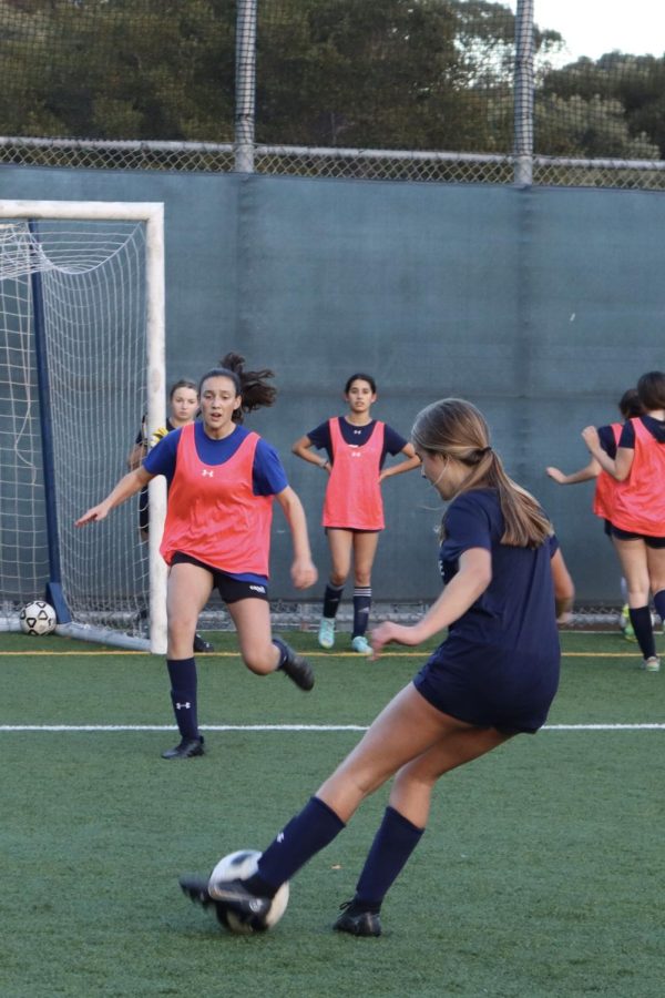 Olivia McGlynn ‘26 dribbles the ball toward  the goal during JV soccer practice.