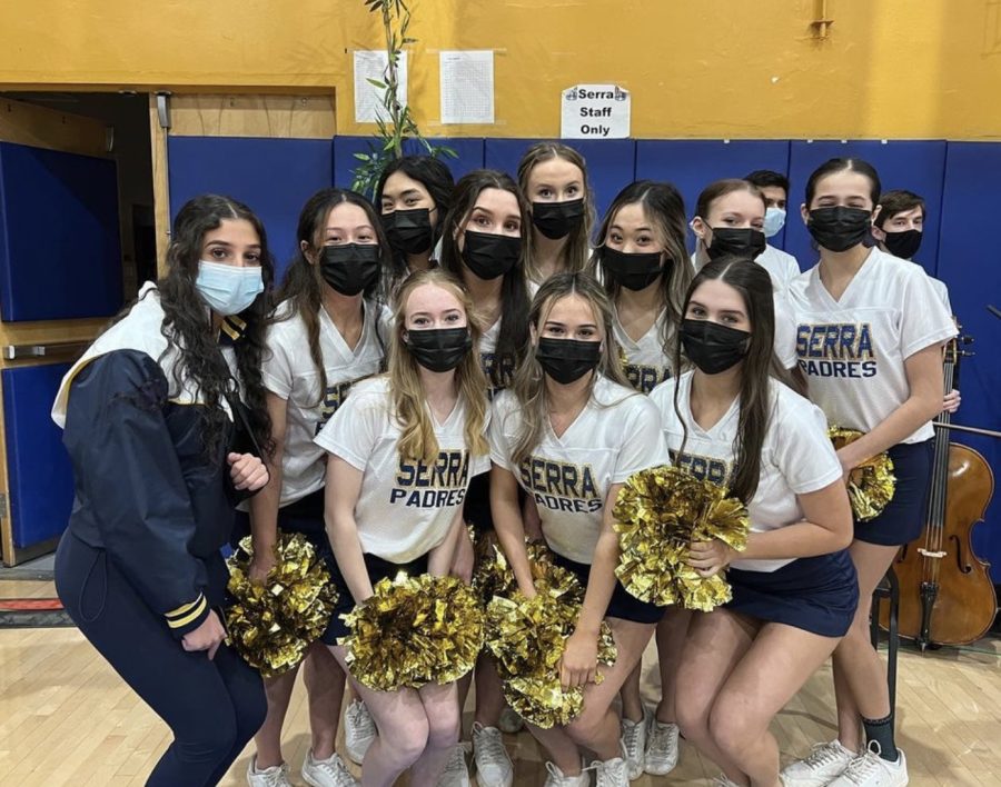 The Notre Dame Spirit Squad pose for a picture on the sidelines at the 2021-2022 Jungle Game.