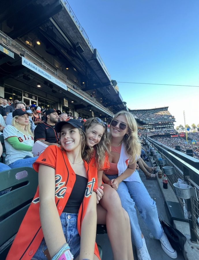 Juniors Ashley Turner, Karly Bordin and Annie Lester support the San Francisco Giants at Oracle Park while sporting the team’s colors.
