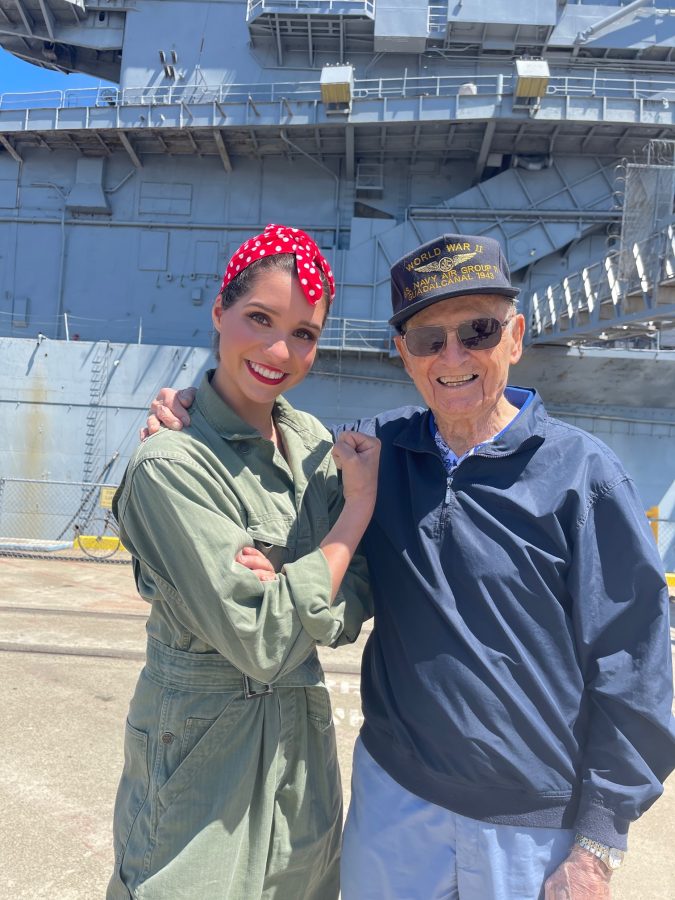 Ava Marinos poses with a WWII veteran.