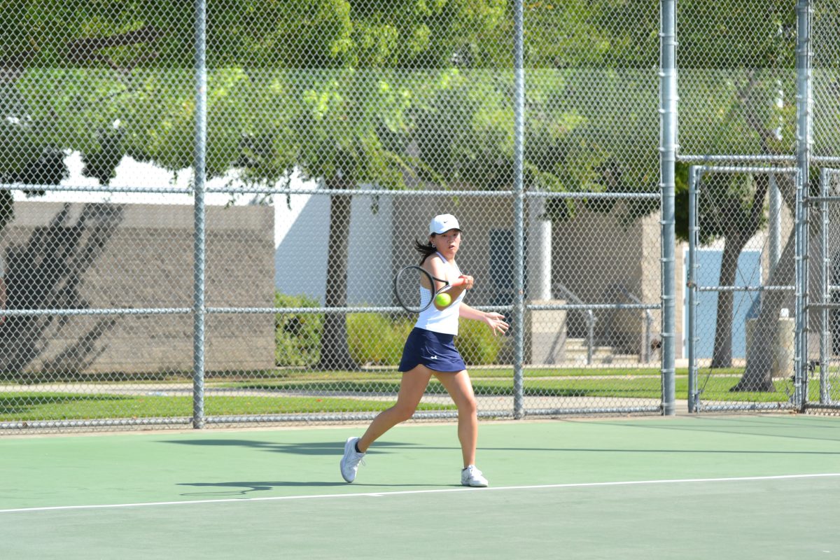 Varsity+Tennis+Co-Captain+Tiana+Pan+%E2%80%9824+fights+to+win+the+point+in+her+match.