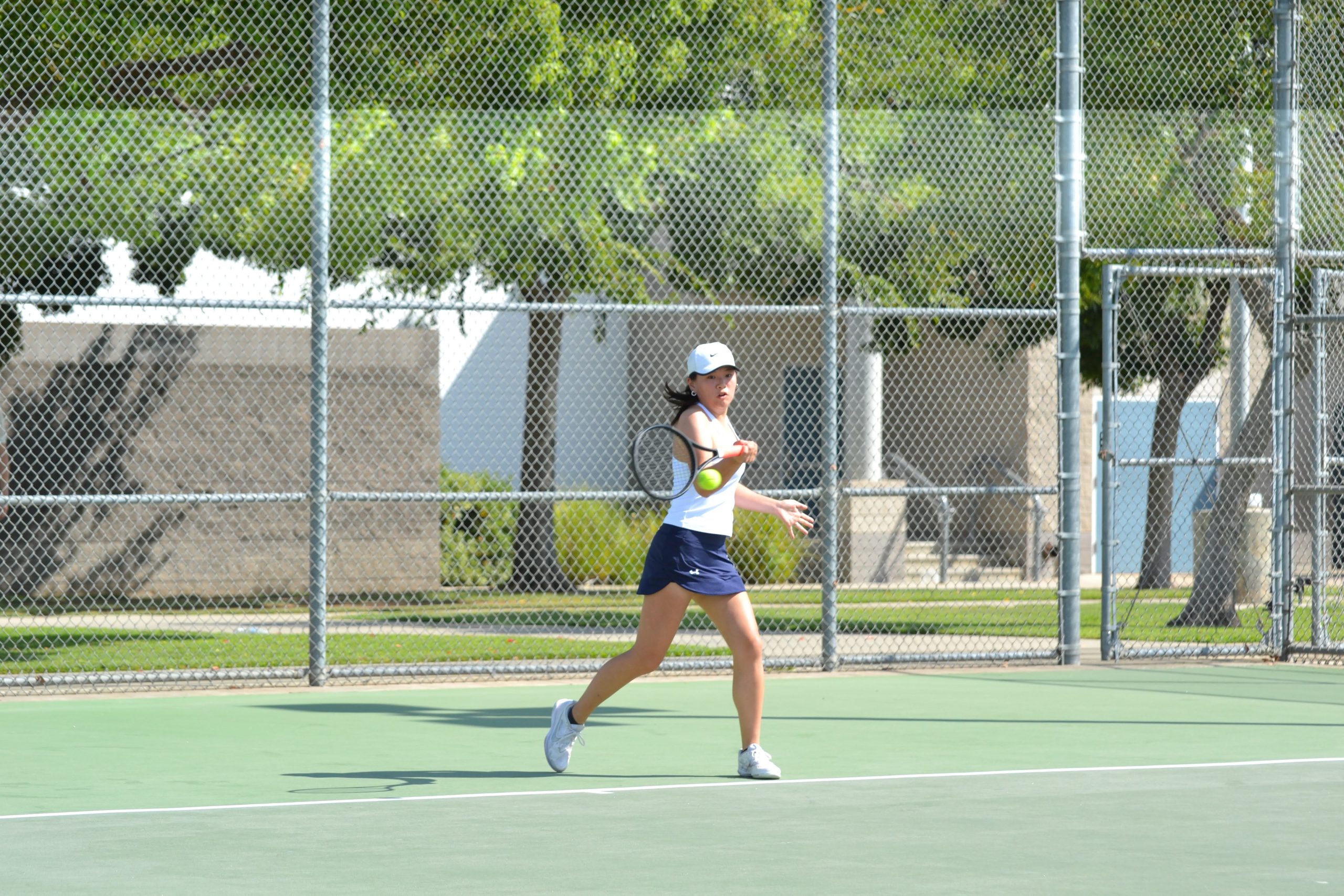 Varsity Tennis Co-Captain Tiana Pan ‘24 fights to win the point in her match.