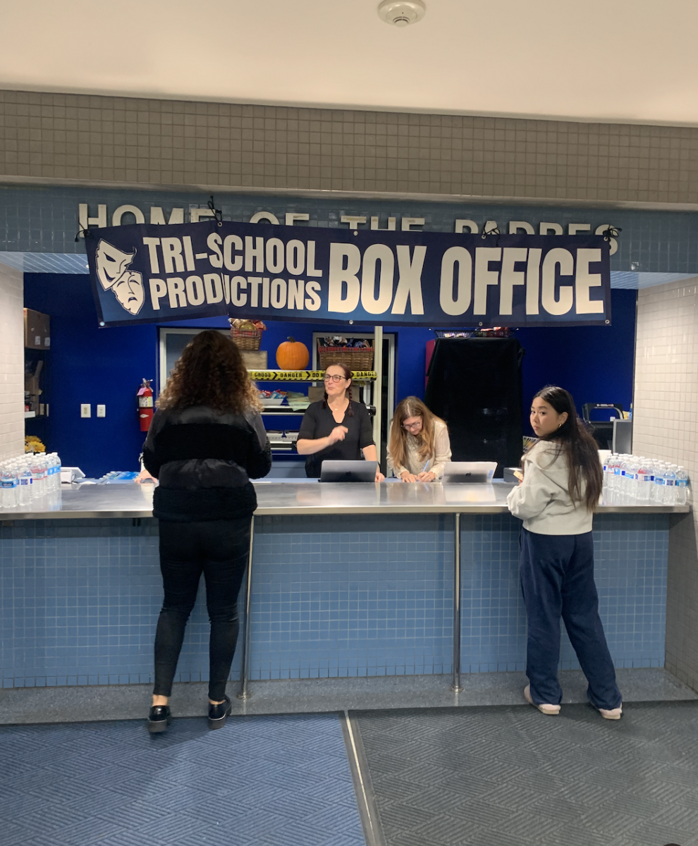 Students and parents buy tickets for the Tri-School play, As You Like It.