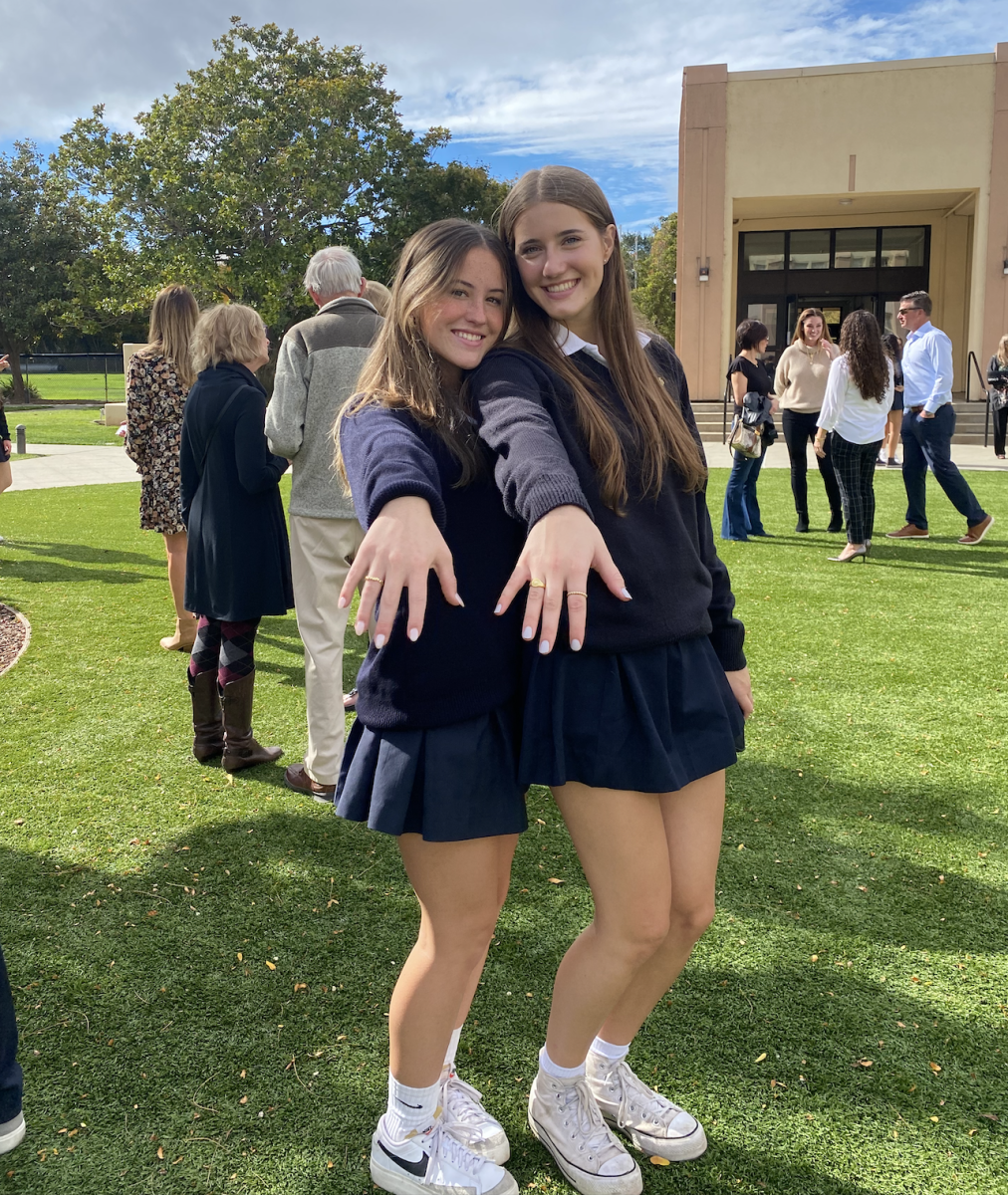 Juniors Ava Baldi and Tessa Turiello show off their newly blessed rings.