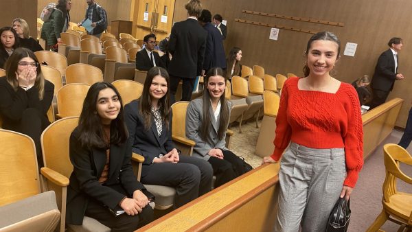 Senior Sabrina Philip (right) poses with members of NDBs mock trial team as they wait for court to be called into session on Thursday, February 1.  NDBs prosecution team argued against the combined Mercy and Serra HSs defense team in the case People v. Clark.