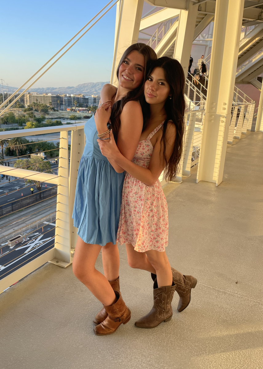 Juniors Gabby Goldfarb and Maia Mejia-Young pose at a country concert venue.