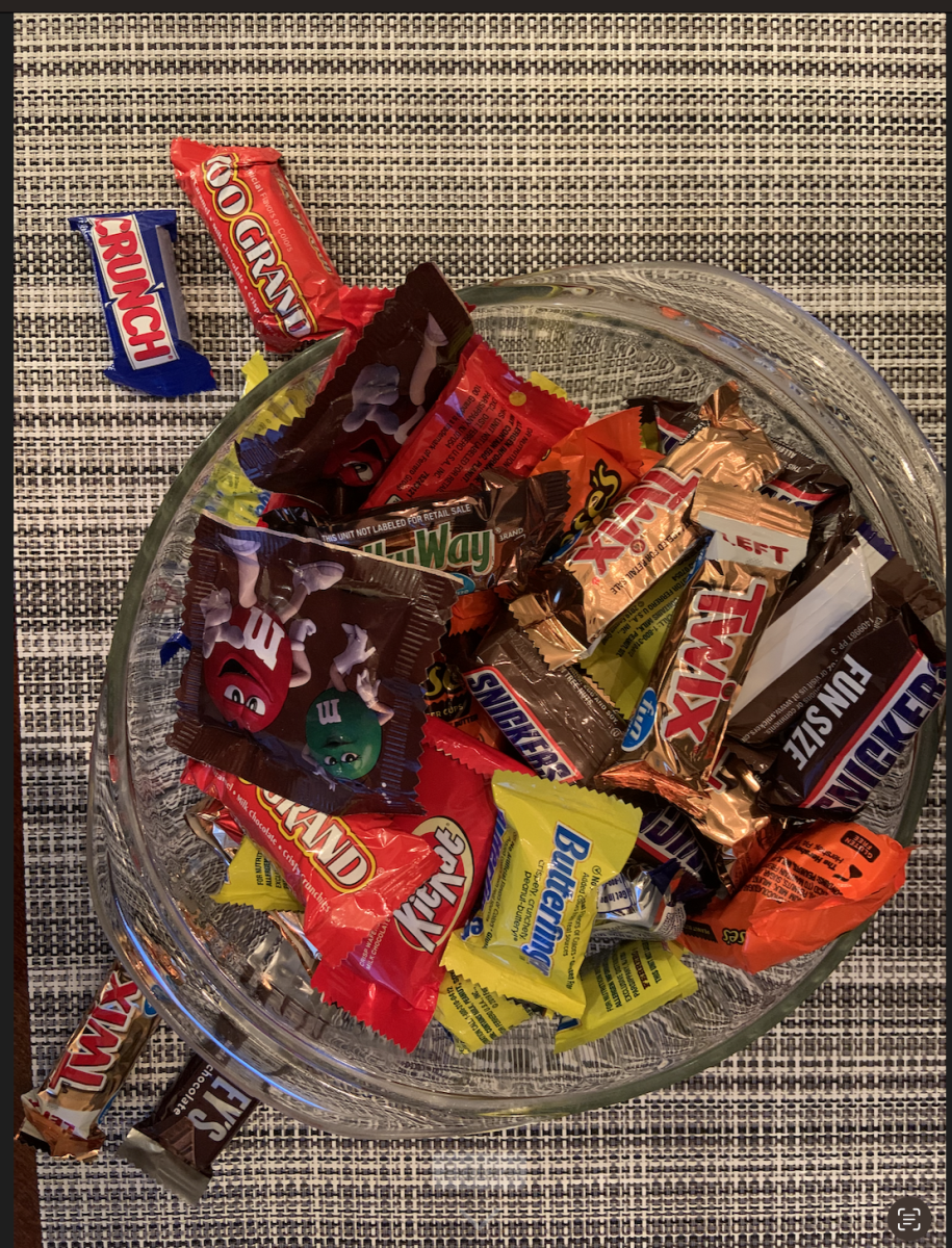 Many students go trick-or-treating, bringing home a lot of candy.