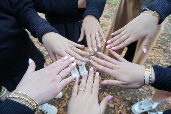 Juniors showing their rings at the ceremony on November 17.