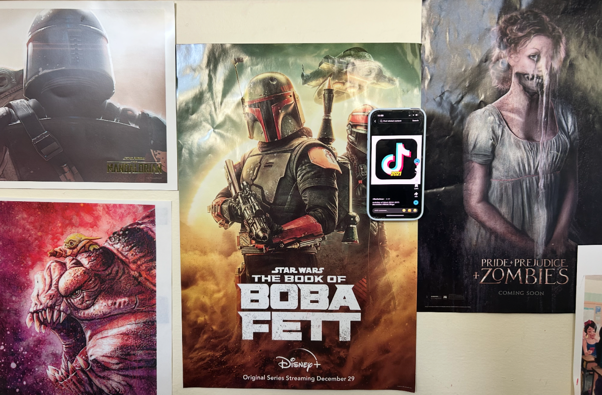 Tiktok app opened next to various movie posters.