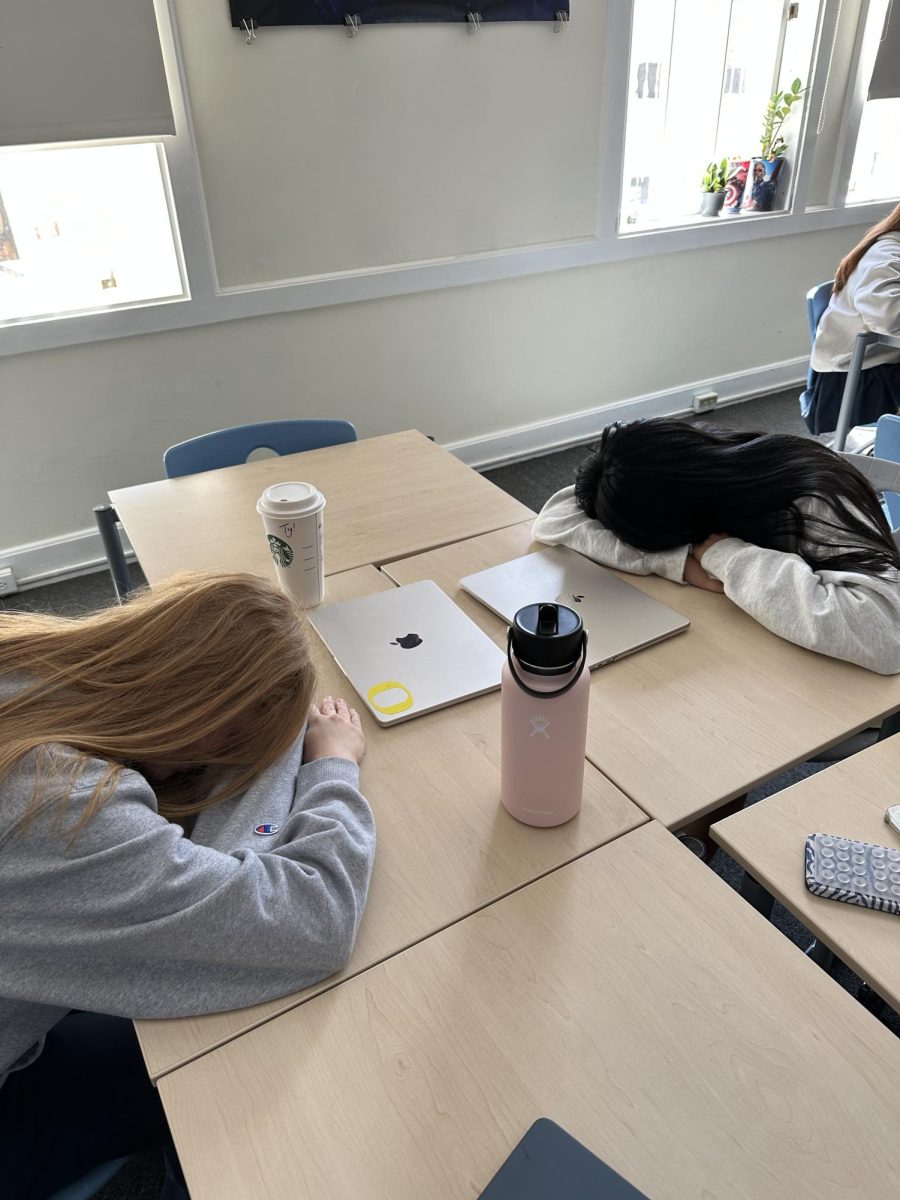 Students worn out and exhausted from all the school work piling up. 
