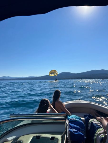 Juniors Amelia Breckenridge, Keira Kennon, and Fiona Guiney relaxing on a boat last summer.