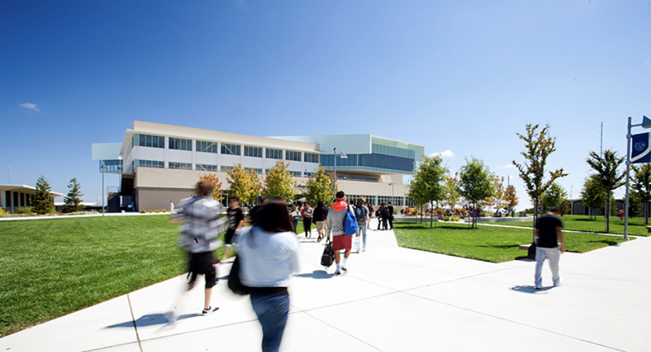 A still of the College of San Mateo's website displays students on campus.