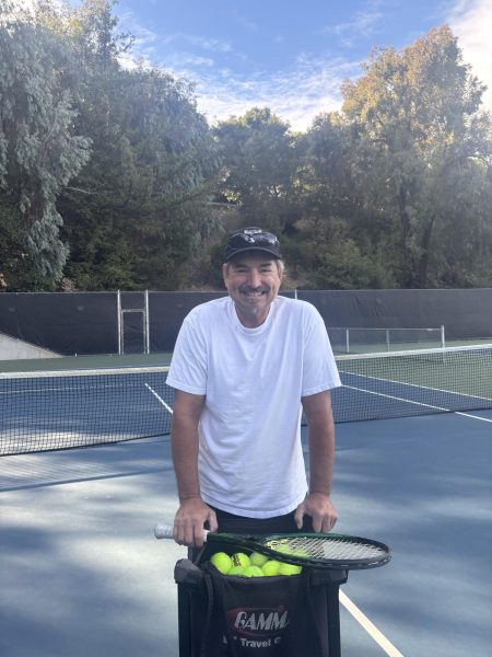 New tennis coach, David Tyler, poses for a photo at CSM tennis courts, the practice location for the team. 