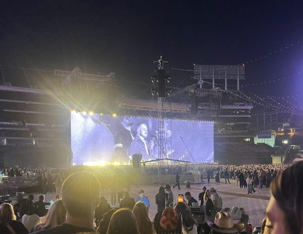Fans pack the stadium for Zach Bryan, a sign of country music’s growing role in American culture and identity.