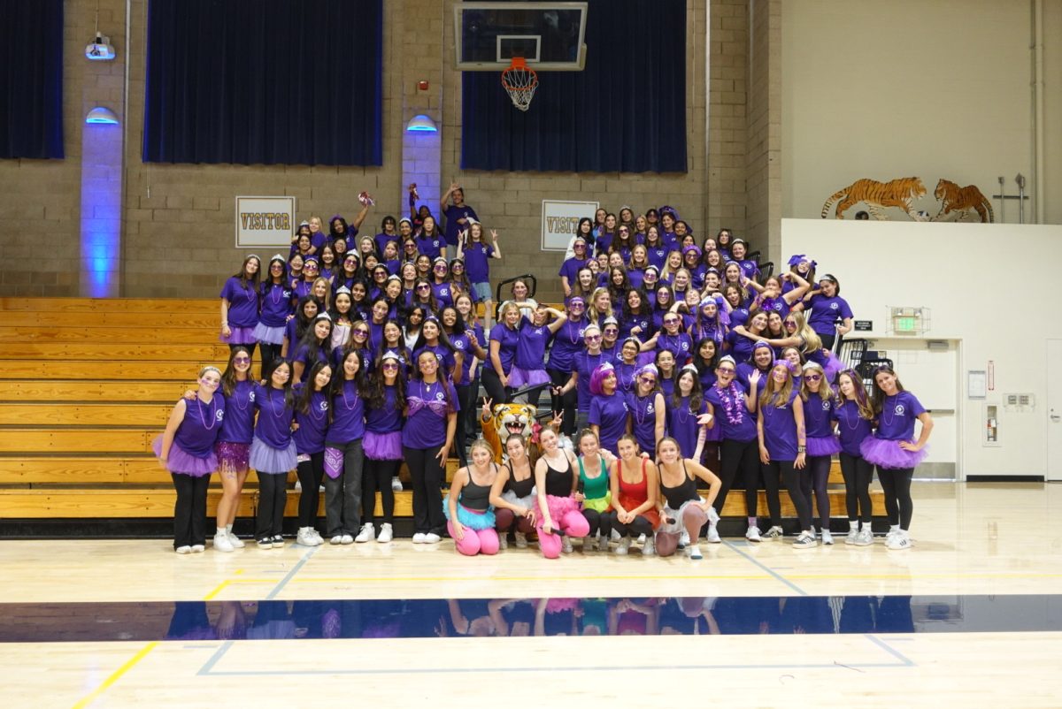 The freshman class strike a spirited pose with the ASB officers at the first rally of the school year.