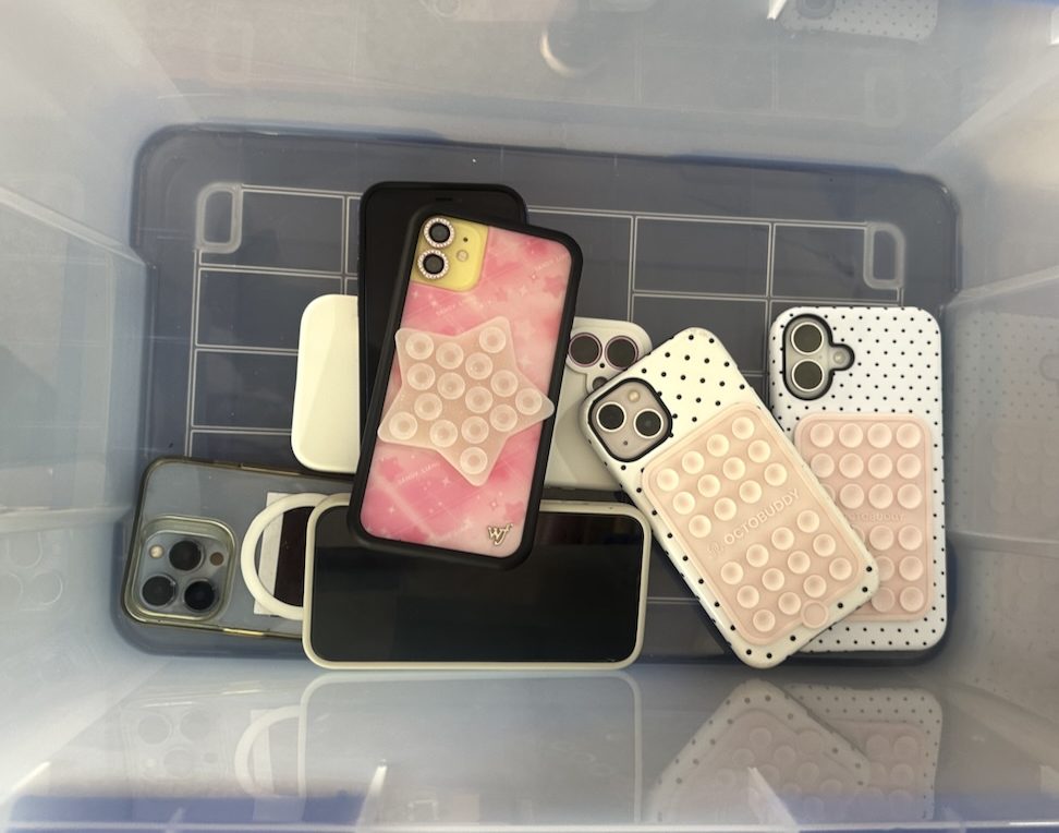 The cell phone policy requires students to place their phones in the classroom’s plastic box before class. 