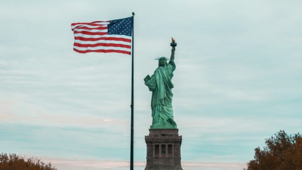 The Statue of Liberty and the American flag are two world-renowned symbols of America's glory - and representations of freedom, justice, and equality.