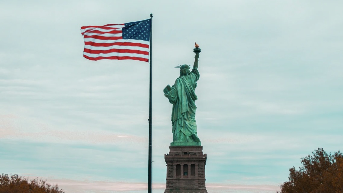 The Statue of Liberty and the American flag are two world-renowned symbols of America's glory - and representations of freedom, justice, and equality.