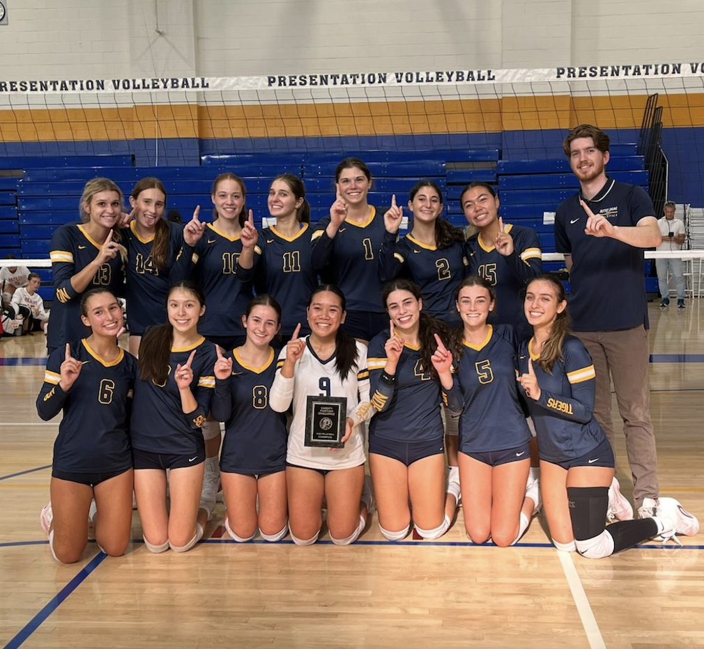Varsity volleyball team taking the championship at the Presentation tournament. 