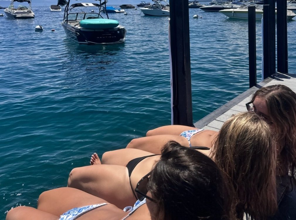 Teens work on getting that sun-kissed look in the hot summer sun.
