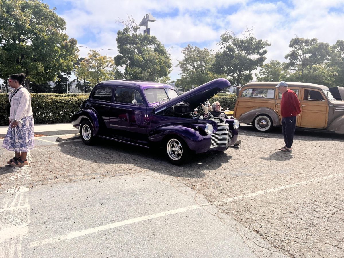 Local community members admire the various cars located throughout the event.