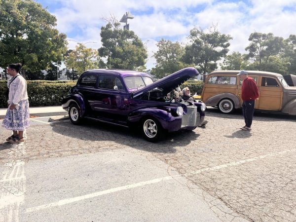 Local community members admire the various cars located throughout the event.