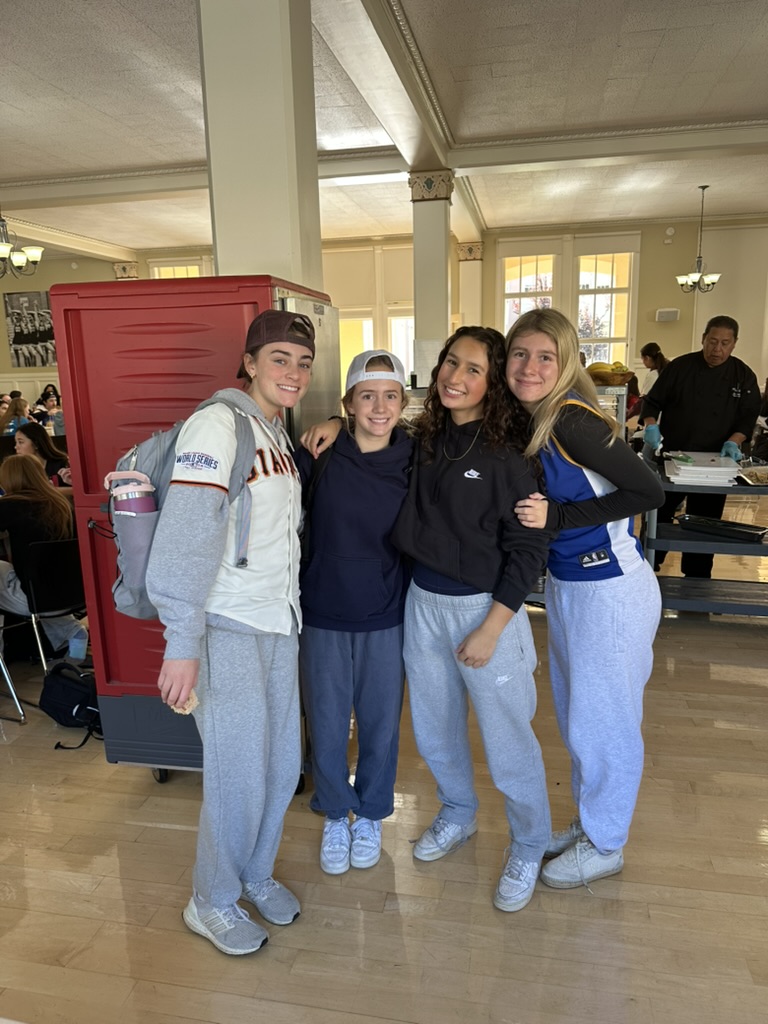 Sharks: Amelia Breckenridge, Gianna Beltramo, Reagan Raff, and Avery Jones pose in their spirited outfits.