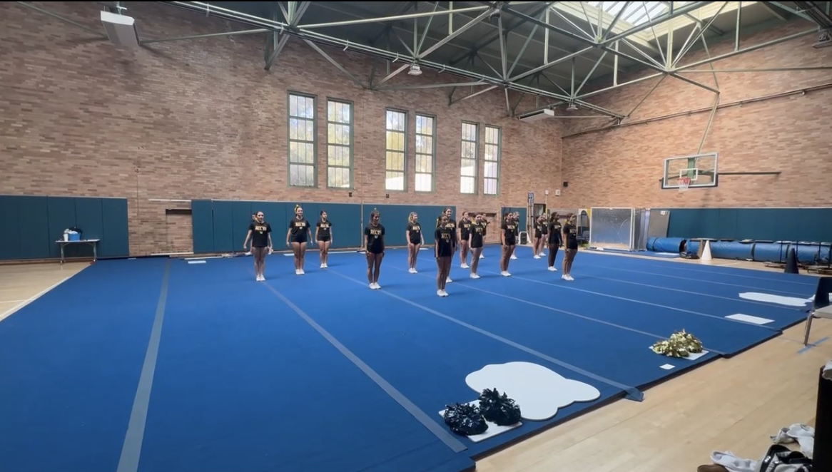 The cheer team practices their “Zombies”-themed routine for the rally.