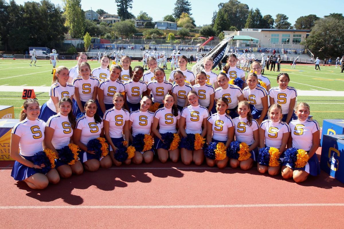The cheer and pom teams bring tri-school spirit to Serra HS’s football games throughout their season.