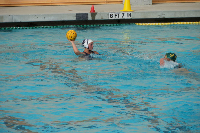 Freshman Alessandra Colorado looks to her teammates to makes a pass during a recent water polo match.