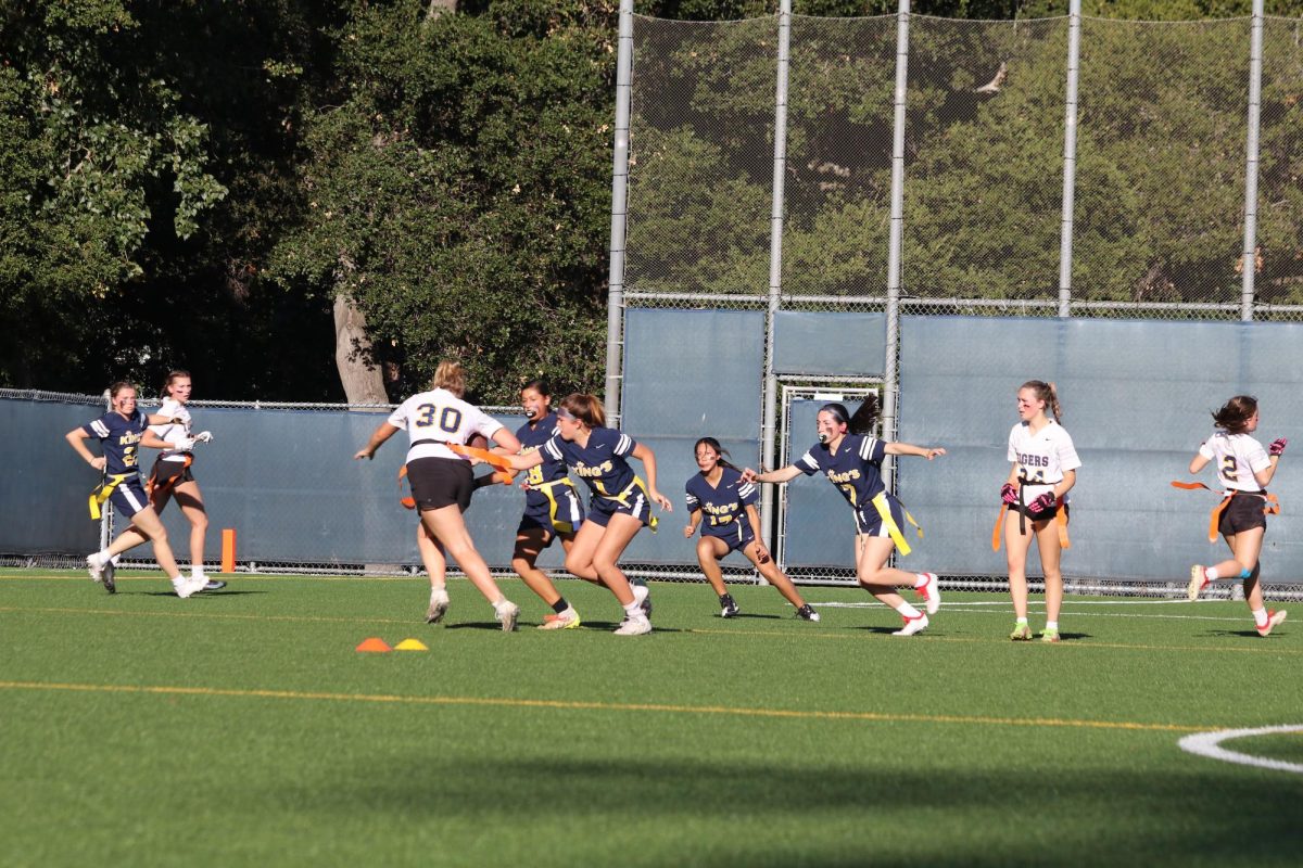 Flag football team players try to get by The King’s Academy defense during a recent game at NDNU’s Koret Field.