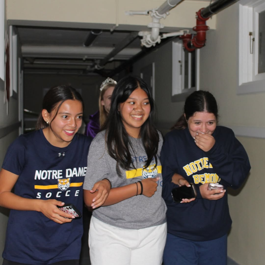 Several Link Crew members and freshman Panthers stroll through the Link-O-Ween Haunted House.