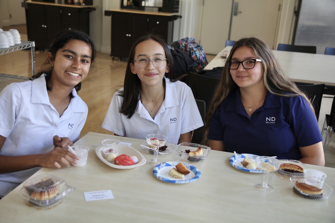 Students sample flavors at the Hispanic Heritage Month Food Fair. 