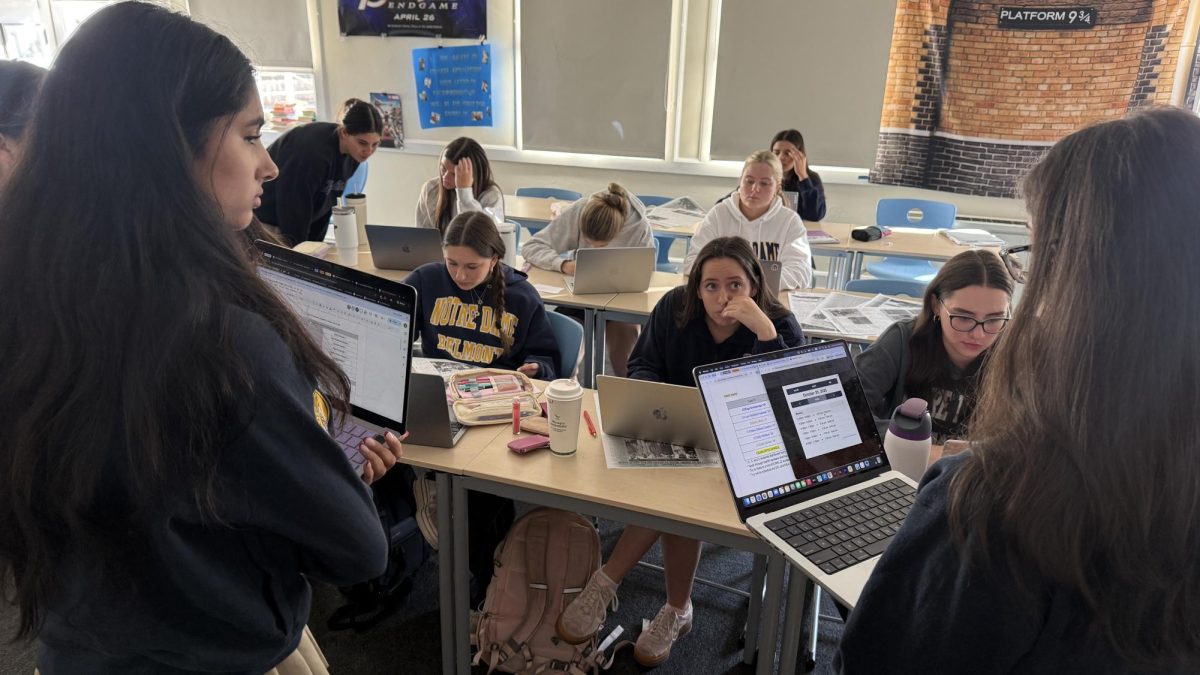 Student journalists meet to discuss story ideas and their upcoming deadlines.